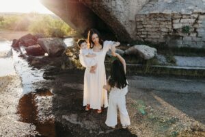 Mom with daughters in Carlsbad, NM under Eddy County Flume