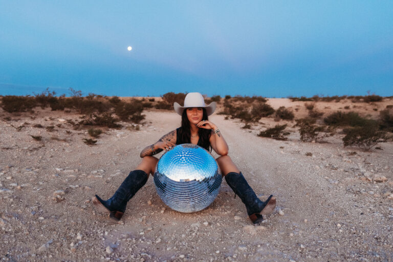 Retro 70s-inspired branding photo for Outlaw Tanning, showcasing bold western style at golden hour.